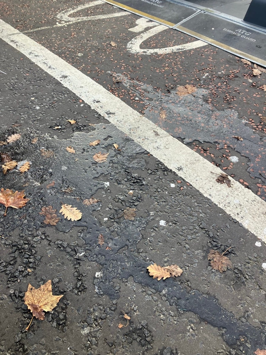 Ice from the ice rink laying black ice and frozen wet leaves on the “bike path”